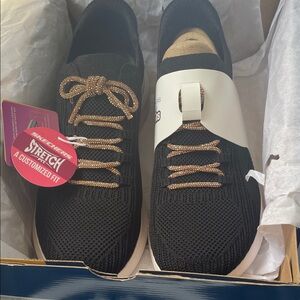 Brand new. Never worn. 
Black with light cream sole
rose gold glittery laces